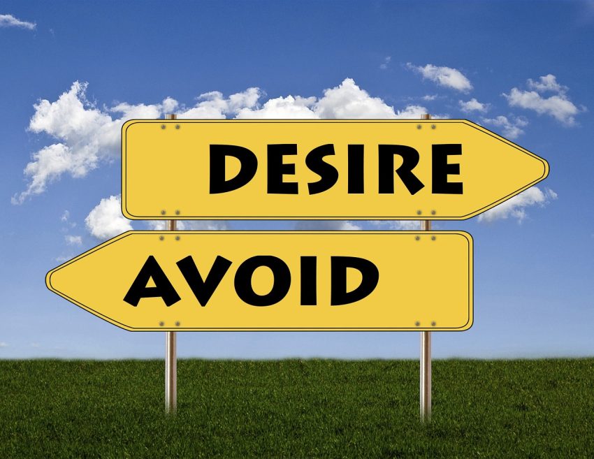 Desire and avoid signs pointing in opposite direction