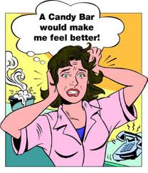 A sressed out woman with hands on her head saying A candy bar would make me feel so much better.